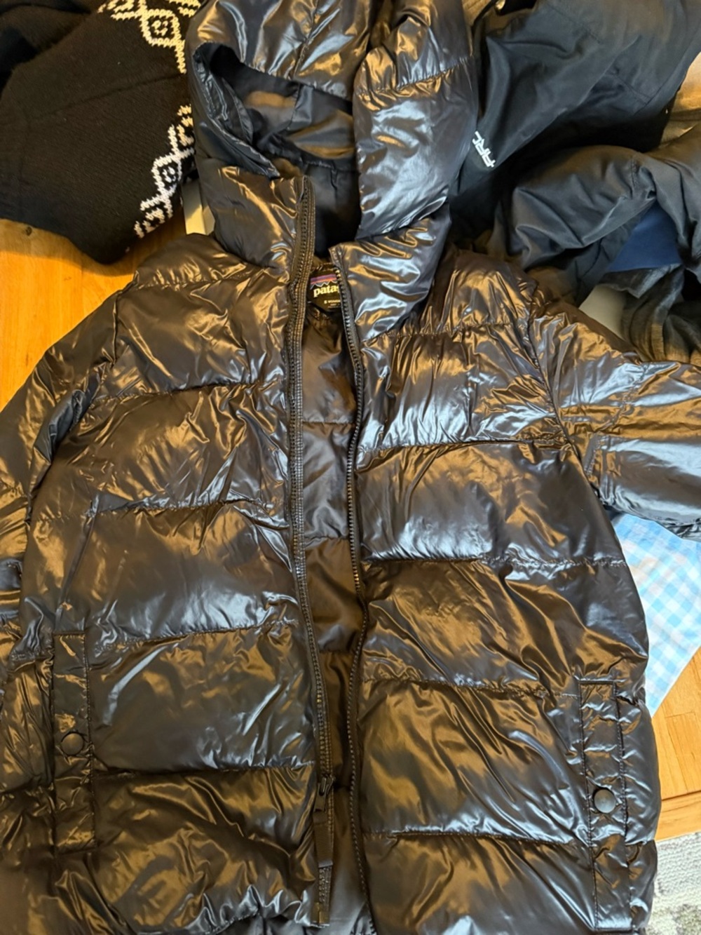Patagonia women’s Shiny Black Puffer Jacket with Hood